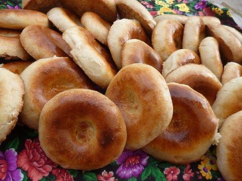 A pile of bread rolls sitting on top of a table